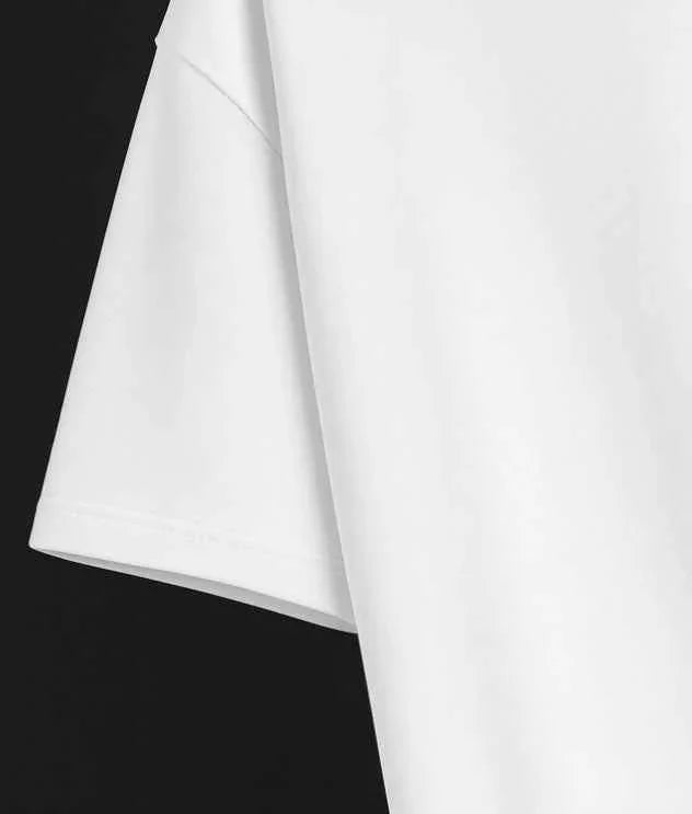 White oversized streetwear tee sleeve close-up, premium fabric, Flex Your Vibe clothing