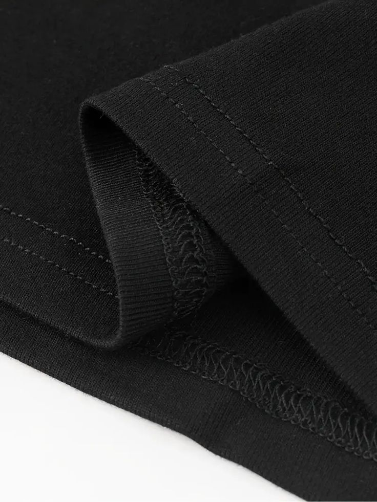 Close-up of black fabric with a white background